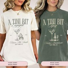 two women wearing matching t - shirts with the words, a thin bit and a martini