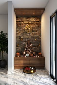 a living room with a buddha statue on the wall and potted plants next to it