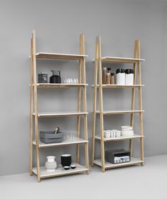 two shelving units with various items on them