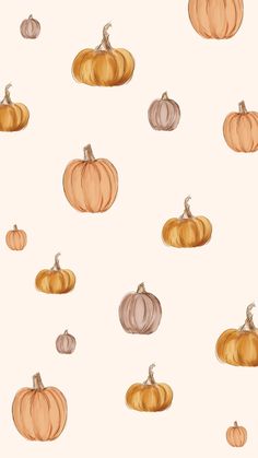 an image of pumpkins painted in watercolor on a white background with orange and pink colors