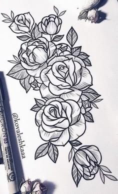 a drawing of roses on paper with markers and pencils next to the ink pen