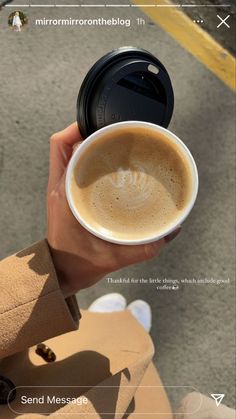 a person holding a cup of coffee in their hand with the caption's information below it