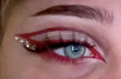 Makeup Ideas With Red Eyeliner, Red Inspo Makeup, Red Eyeliner With Gems, Eyeliner And Gems Makeup, Makeup Jewels Eye, Red Eye Makeup Gems, Red Graphic Makeup Looks, Red And Black Concert Makeup, Red Devil Halloween Makeup