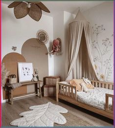 a child's bedroom with a canopy bed and rugs on the wooden floor