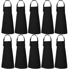 six black aprons with straps on each side and one in the middle, all facing different directions