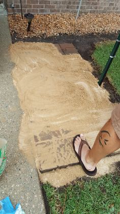 a person standing on top of a dirt covered ground