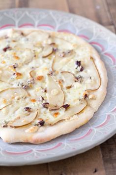 a pizza sitting on top of a white plate