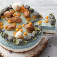 there is a cake decorated with animals on it