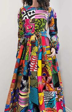 African Printed Long-Sleeve Patchwork Dress with belt     Zip at the back     Round neck     2 open side-entry pockets     With belt     Exact length from the shoulder to the bottom 61" / 156 cm     100% wax cotton     Handmade     Made in UK Due to the nature of Patchwork design, every dress is unique and colour and pattern on individual patches may differ from the photos shown. (Colours may vary due to lighting on images. The product images are closest to the true colour of the product.) Handmade Uk, Full Length Dress, African Print Fabric, Patchwork Dress, Long Sleeve Maxi, Patchwork Designs, Waxed Cotton, Dress 100, Product Images