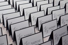 many business cards are lined up in rows