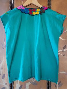 "70s lovely bright emerald green blouse with bright embroidery Black stitching at cuffs and around the V- neck Bust across 21\" (42\" around) Length 23\" Across shoulders 21\" Arm openings 16\" around **a couple of very light blue Mark's on left side. Little mend at bottom left side" Velvet Shrug, Bright Embroidery, Emerald Green Blouse, Hippie Blouse, Heart Pocket, Pink Suede, Green Blouse, Crushed Velvet, Sheer Sleeves