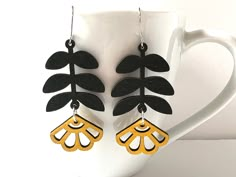 These beautiful Matisse inspired yellow flower laser cut wood earrings make a statement!  Perfect to go with any outfit. The plant shapes are laser cut out of lightweight wood and measure 30mm by 55mm. You can choose surgical stainless steel hooks or solid sterling hooks. Lightweight earrings with a bold vibe! To prolong the wear of the wood, take the earrings off when submersing into water. Acrylic Laser Cut Earrings, Laser Wood Earrings, Wood Earrings Cricut, Laser Cut Earrings Wood, Laser Cut Wood Projects, Laser Earrings, Laser Cut Wood Jewelry, Laser Engraved Earrings, Wood Leaves