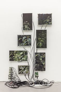 an art piece with multiple frames and wires attached to it