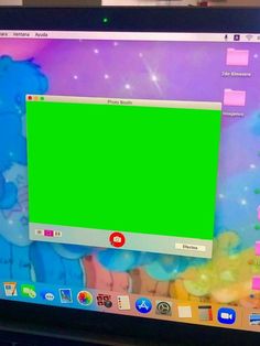 a computer monitor with a green screen on it