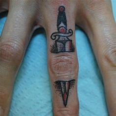 a woman's hand with a tattoo on it