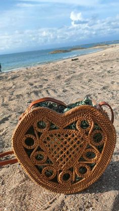 Surprise your loved one with a unique handmade Bali rattan bag this Valentine's Day. A gift that shows your love in a truly special way. All our rattan bags are free shipping. Lenght = 20 cm Height= 20 cm Width = 8 cm Strap is adjustable. Every single one of these rattan bags is crafted by hand. No two bags are exactly the same, so there might be slight variations in size and color between each bag. Crafted from premium-grade rattan, bamboo materials, artificial leather straps, and adorned with Western Style Interior, Rattan Bags, Environmental Conservation, Rattan Bag, Love Shape, Boho Living, Cow Hide Rug, Cow Hide, Boho Living Room