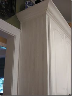 a pair of shoes sitting on top of a white cabinet