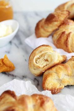 some croissants are sitting on the table