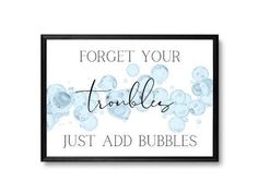 a framed sign that says forget your troubles just add bubbles on the front and back