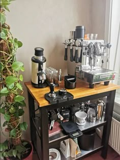 an espresso machine sitting on top of a wooden table