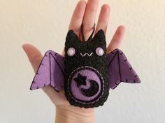 a hand that has a small bat on it