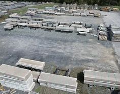 an old parking lot full of concrete benches