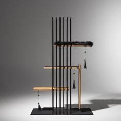 an artistic display with black and wood items