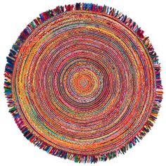 a round rug with multicolored fringes on the bottom and center, in various colors