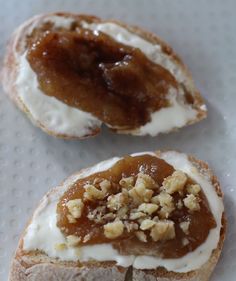 two donuts with white frosting and toppings on them