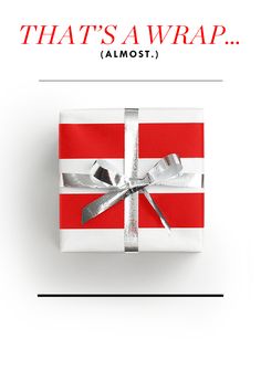 a gift wrapped in red and white paper with the words, that's a wrap almost