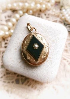 "Beautiful French Antique XIX-Century Gold Filled Victorian Seed Pearl and Onyx Reliquary Oval Photo Holder Engraved Locket, Gift for Woman  Size -  Total length -  approx. 34mm / 1,34\" Medallion itself (without hanging circles)- approx. 24x20mm / 0,94\" x 0,79\" Width (measured without the pearl on top) - approx. 8mm / 0,32\" Medallion is in a great antique condition, thick and very high quality, beautifully engraved on front, made of gold filled metal and onyx with natural seed pearl in the center. Inside it has enough of place to hide not only a small photos, but also some pressed flower, piece of fabric or a little object, which should remind beloved person 💕  It close securely with a snap. Rare unique piece! ✨  Pendant will be perfect as a gift for vintage and antique loving woman! Accessorize Jewellery, Engraved Locket, Vintage Wedding Jewelry, Unique Antiques, French Antique, Small Photos, Seed Pearl, Locket Necklace, Pressed Flowers