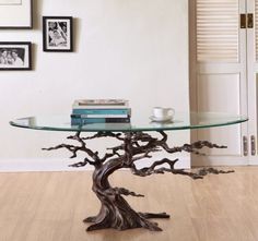 a glass table with a tree design on it