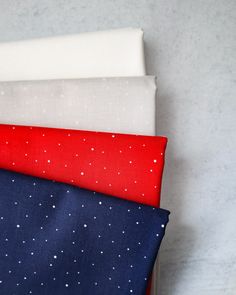 four different colors of fabric with stars on them