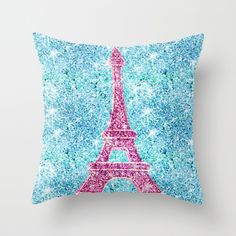 the eiffel tower in pink and blue is featured on this decorative pillow cover