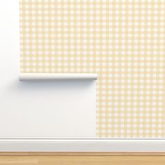 an empty room with yellow and white checkered wallpaper