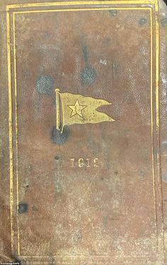 an old book with a star on it