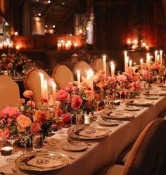 a long table is set with candles and flowers for an elegant dinner or banquet event