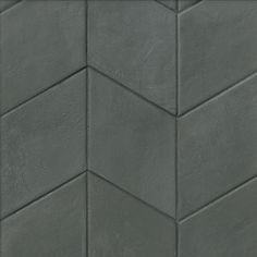 a close up view of a grey tile wall