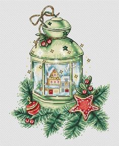 a cross stitch pattern with a christmas lantern and decorations on the front, in green