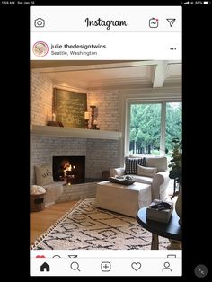 a living room with a fire place and couches in front of a window that reads instagram