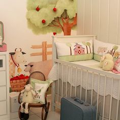 a baby crib with stuffed animals in it