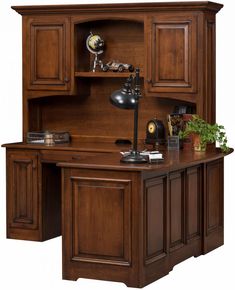 an office desk with wooden cabinets and a lamp on top of the desk, in front of a white background