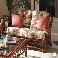 a living room filled with furniture and lots of pillows on top of each other's arms