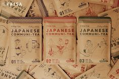 several packets of japanese tea are stacked on top of each other, with the words'japan community - tea'written across them