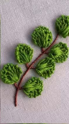 some green leaves on a white cloth