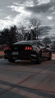 a black sports car parked on the street