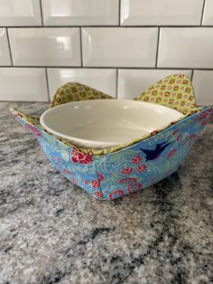 an empty bowl sitting on top of a counter