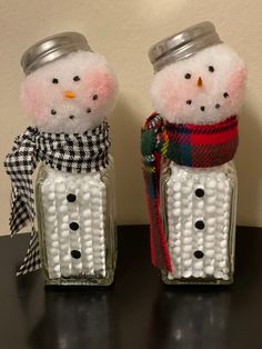 two salt and pepper shakers decorated like snowmen