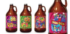 three brown bottles with colorful designs on them