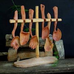 wooden utensils hanging on a wood rack